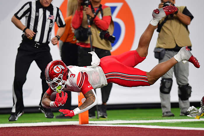 Utah Utes quarterback Ja'Quinden Jackson (3) runs the ball for a touchdown against the Southern California Trojans during the second half of the PAC-12 Football Championship at Allegiant Stadium.